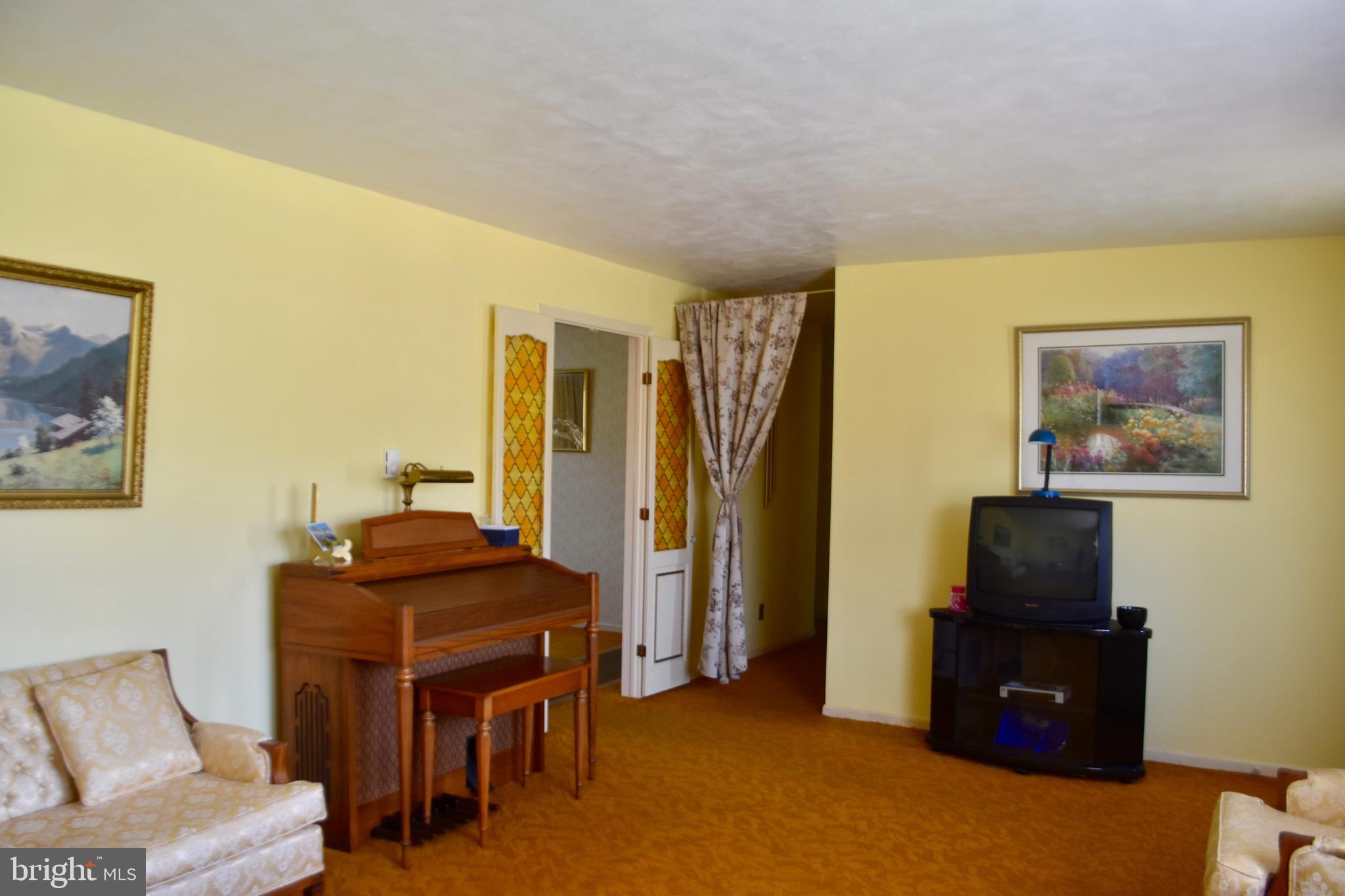 509 Walker Avenue Ewing, NJ 08628 - Photo 3 of 20 a living room with furniture and a flat screen tv