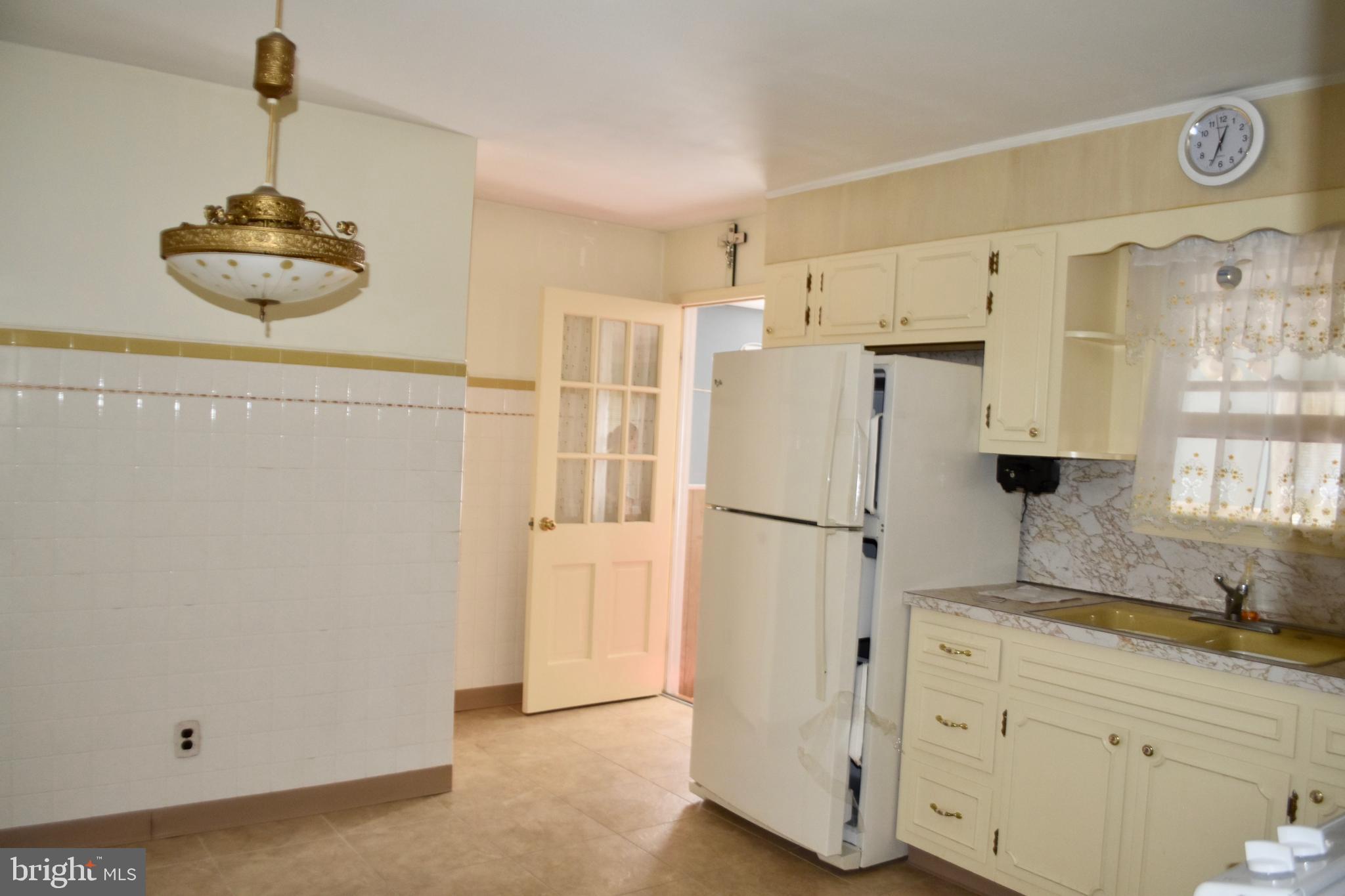509 Walker Avenue Ewing, NJ 08628 - Photo 5 of 20 a kitchen with stainless steel appliances a refrigerator sink and cabinets