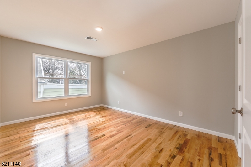 255 Chadwick Avenue, Unit 2 Newark, NJ 07108 - Photo 12 of 23 a view of an empty room and window