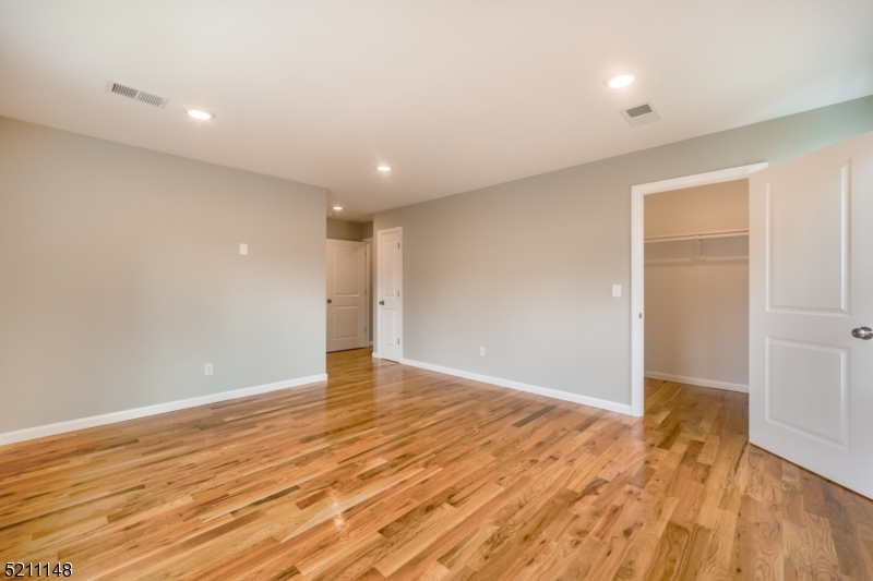 255 Chadwick Avenue, Unit 2 Newark, NJ 07108 - Photo 15 of 23 wooden floor in an empty room with wooden floor