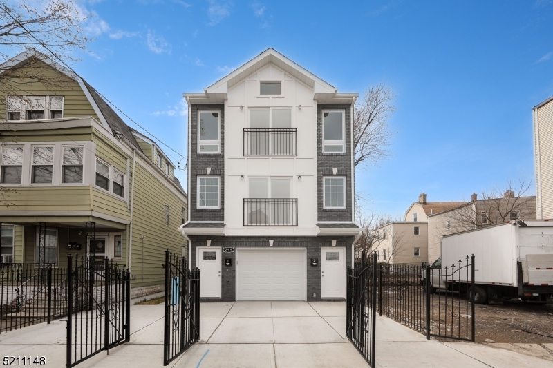 255 Chadwick Avenue, Unit 2 Newark, NJ 07108 - Photo 19 of 23 a front view of a building with glass windows