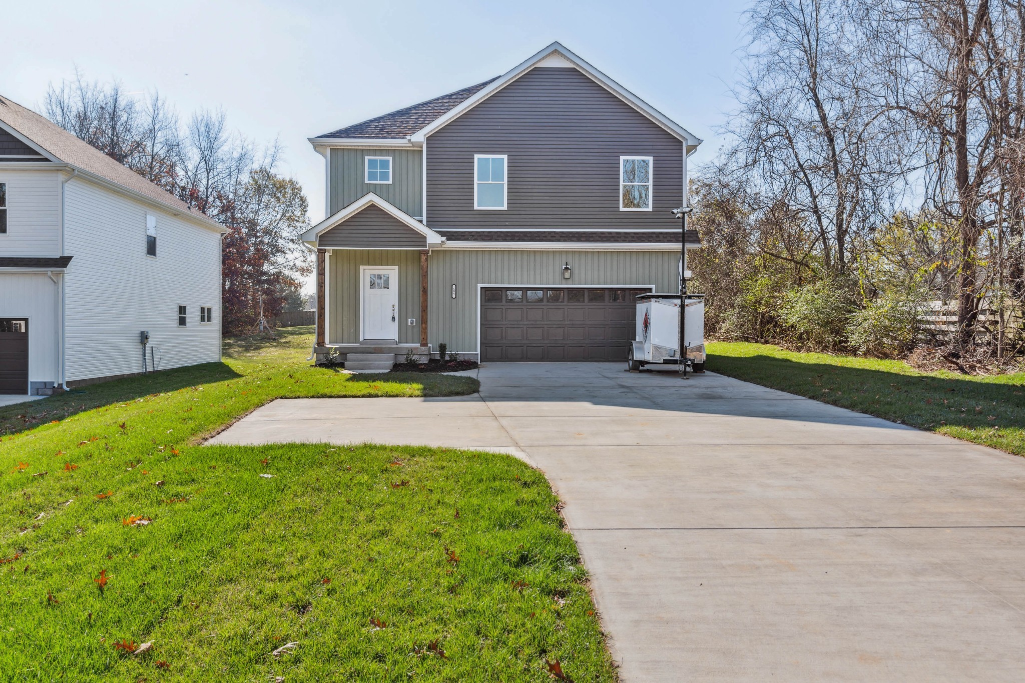 584 Lafayette Road Clarksville, TN 37042 - Photo 1 of 36 a front view of a house with yard and green space