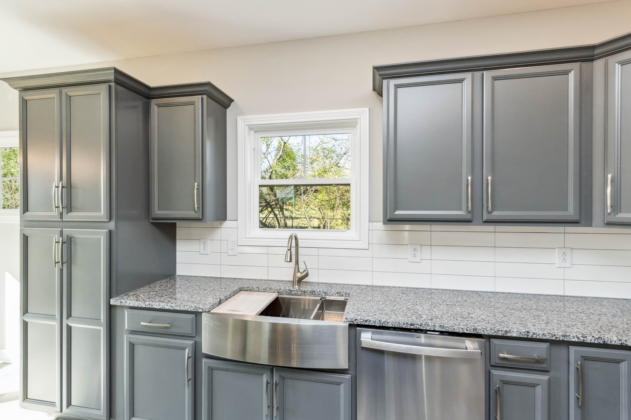 584 Lafayette Road Clarksville, TN 37042 - Photo 11 of 36 a kitchen with granite countertop a sink and a refrigerator