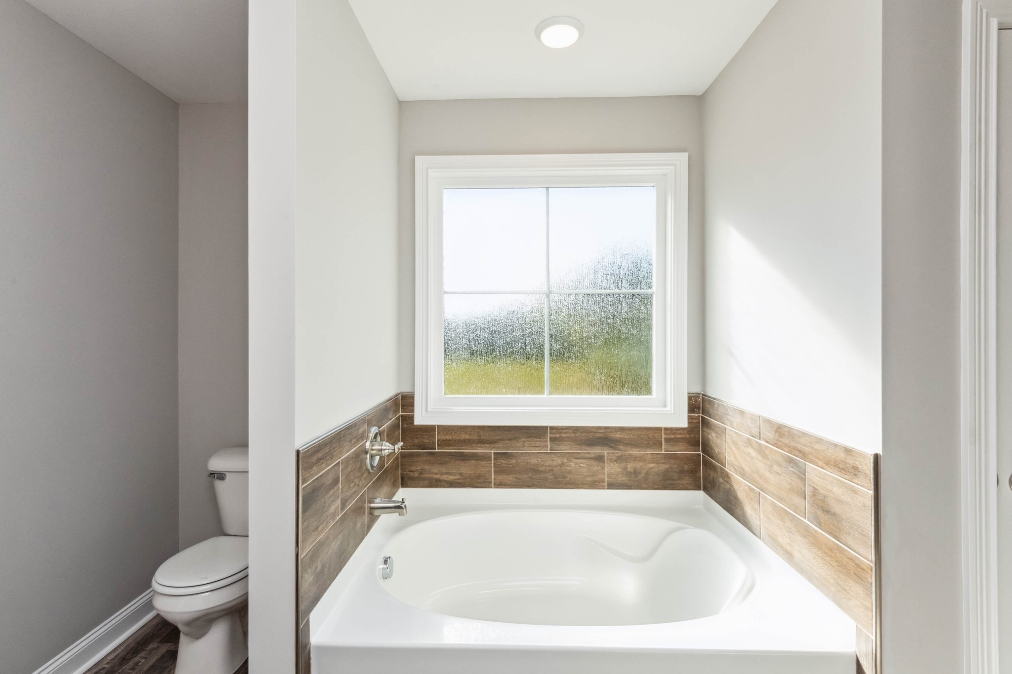 584 Lafayette Road Clarksville, TN 37042 - Photo 19 of 36 a white bath tub sitting next to a toilet