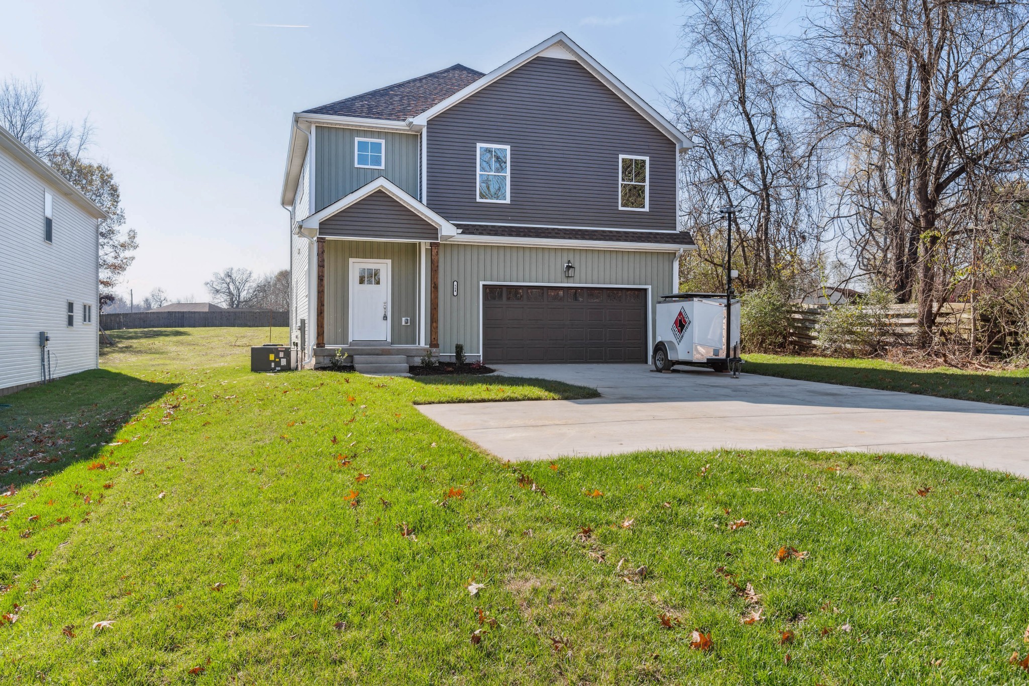 584 Lafayette Road Clarksville, TN 37042 - Photo 2 of 36 a view of a house with a big yard and large tree