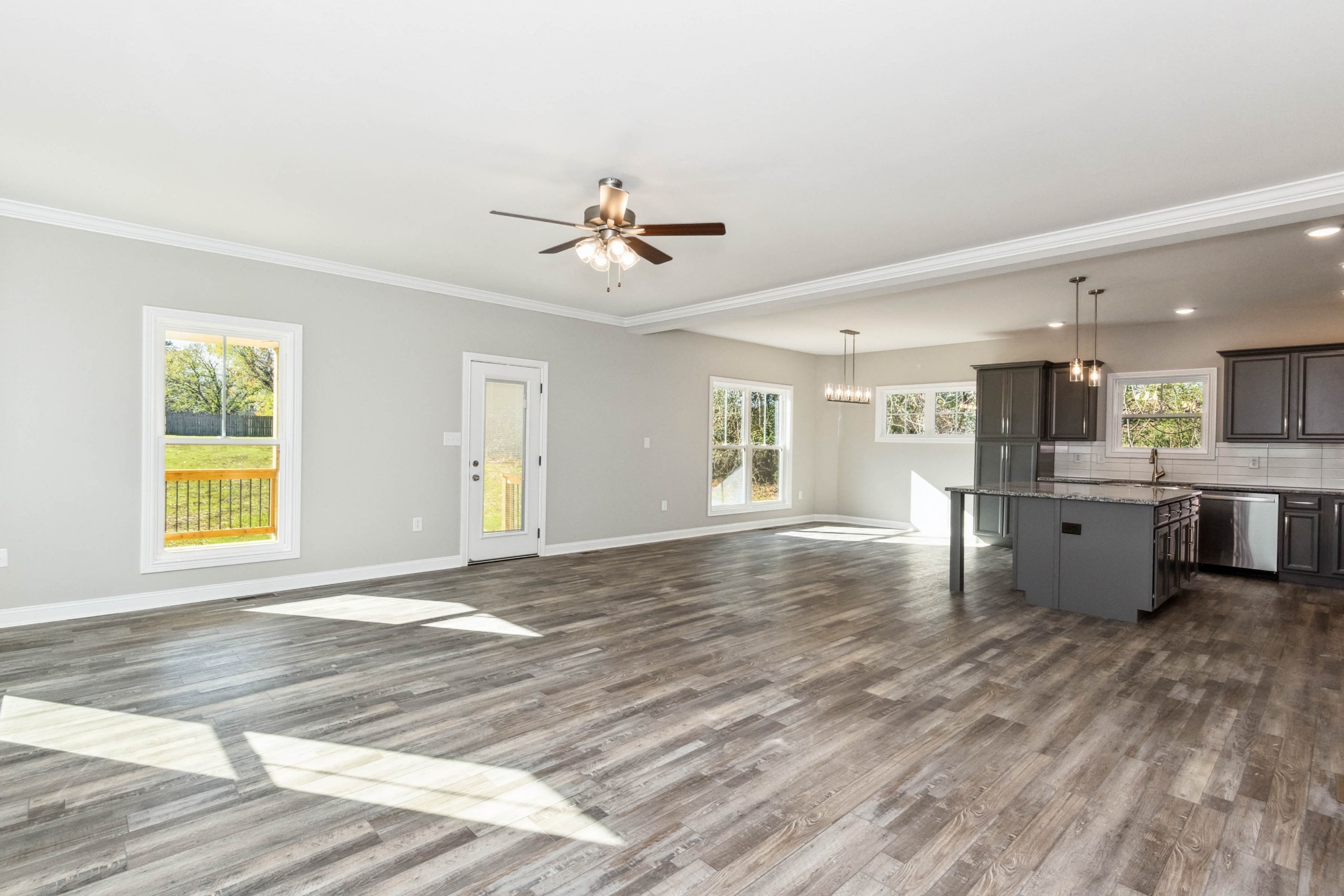 584 Lafayette Road Clarksville, TN 37042 - Photo 5 of 36 a view of an empty room with window and wooden floor