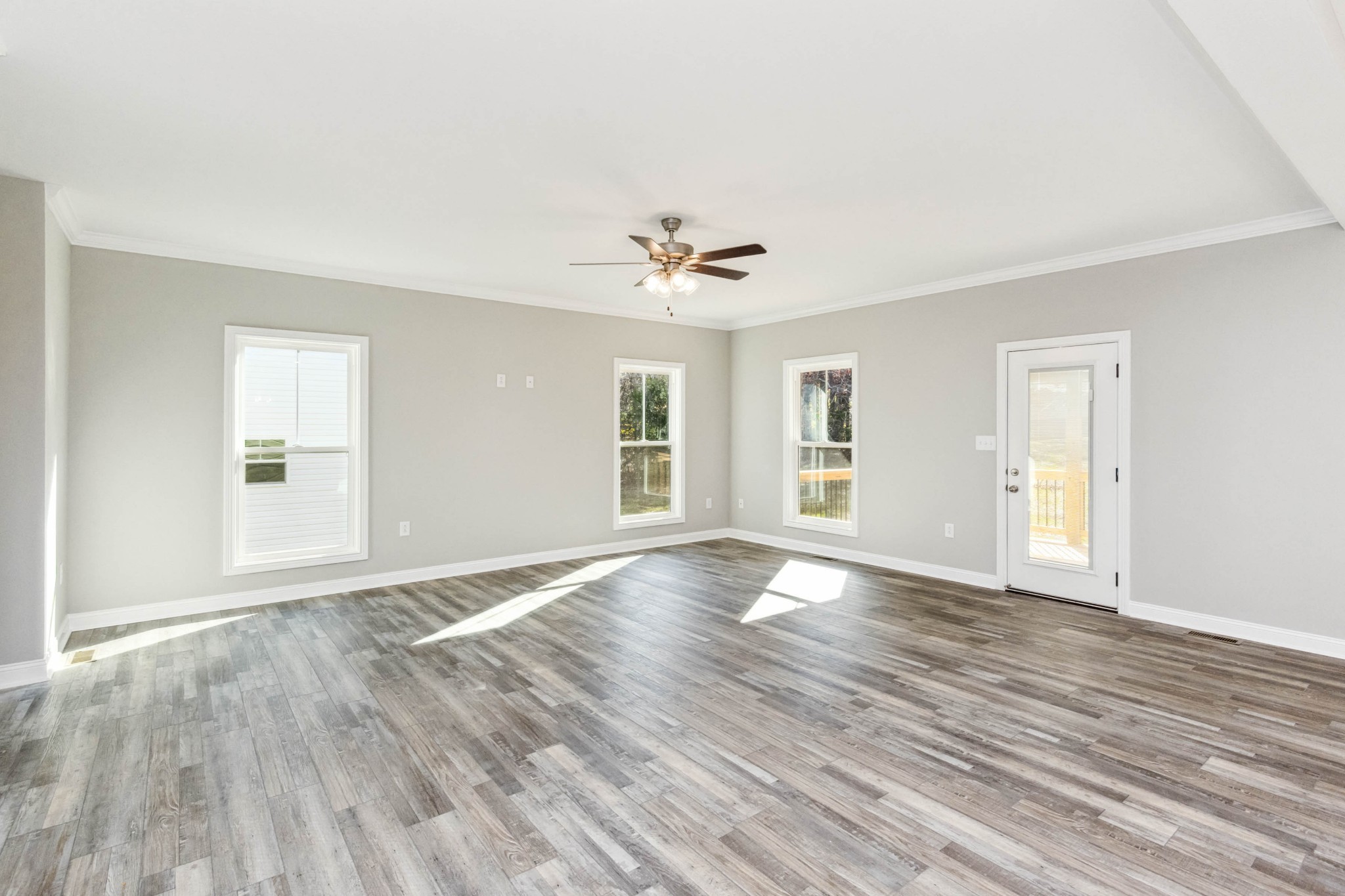 584 Lafayette Road Clarksville, TN 37042 - Photo 7 of 36 a view of an empty room with window and wooden floor