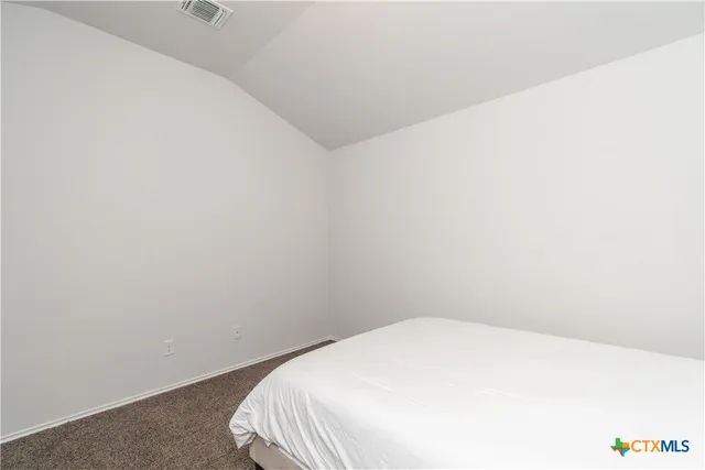 a view of a room with a white wall