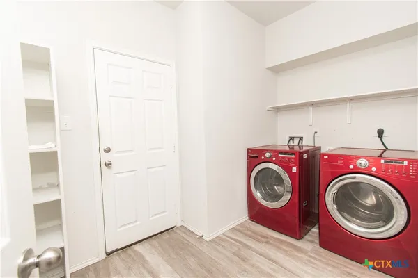 a utility room with dryer and washer