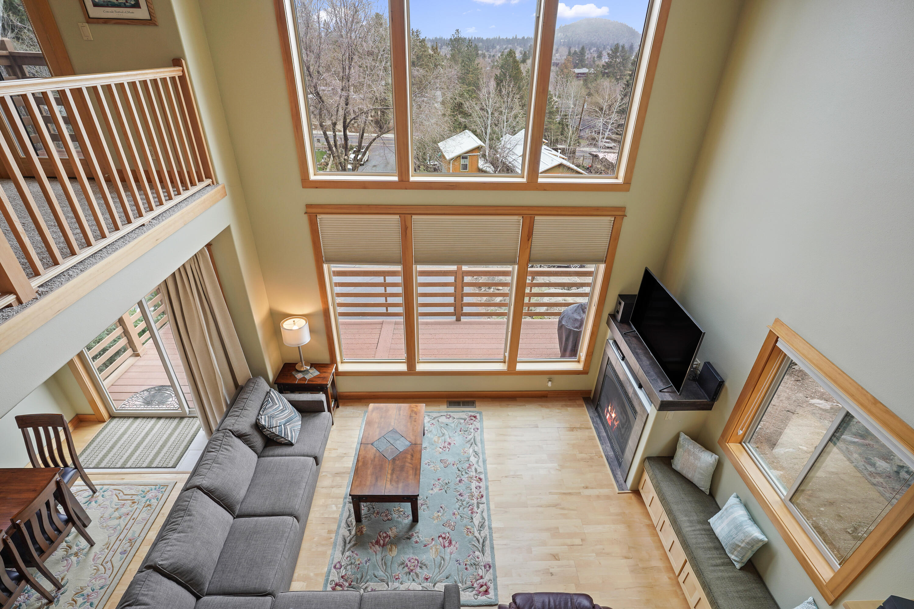 2155 Northwest Awbrey Road Bend, OR 97703 - Photo 23 of 44 a living room with furniture and a flat screen tv
