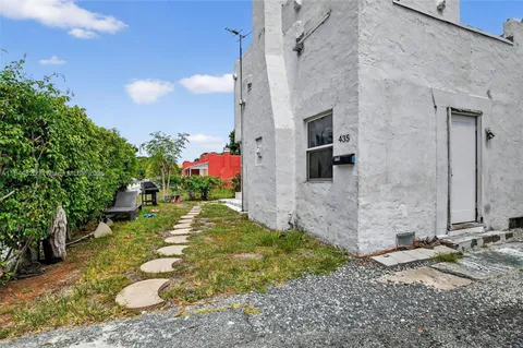 a view of a back yard of the house