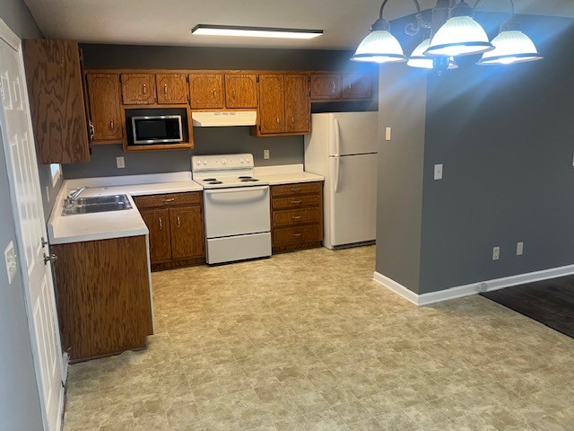 141 Modena Circle Decherd, TN 37324 - Photo 4 of 8 a kitchen with a refrigerator sink and microwave