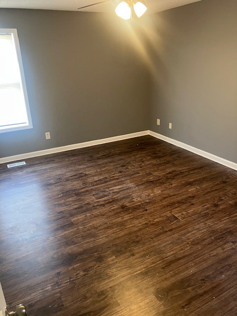 141 Modena Circle Decherd, TN 37324 - Photo 8 of 8 a view of an empty room with wooden floor and a window