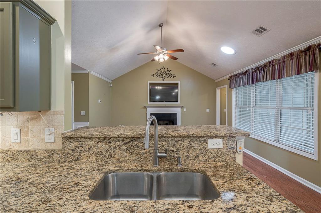 245 Memory Lane Winder, GA 30680 - Photo 19 of 62 a view of a kitchen with a sink and a mirror