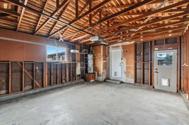 a view of an empty room with wooden walls