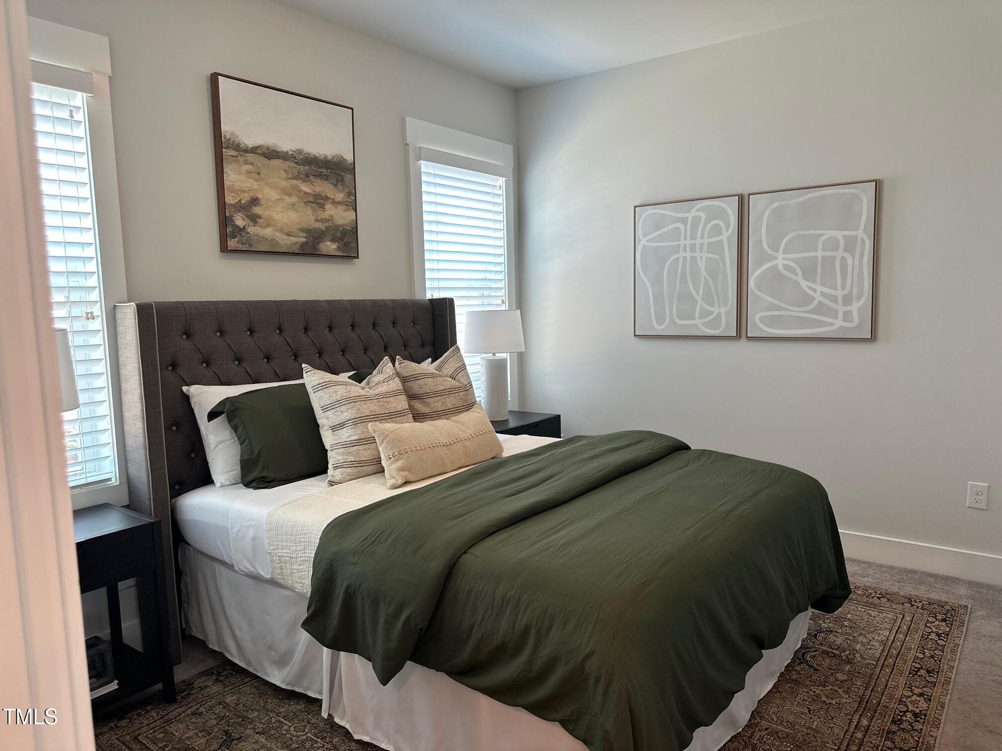 54 Cottage Way Pittsboro, NC 27312 - Photo 13 of 22 a bed sitting in a bedroom next to a window