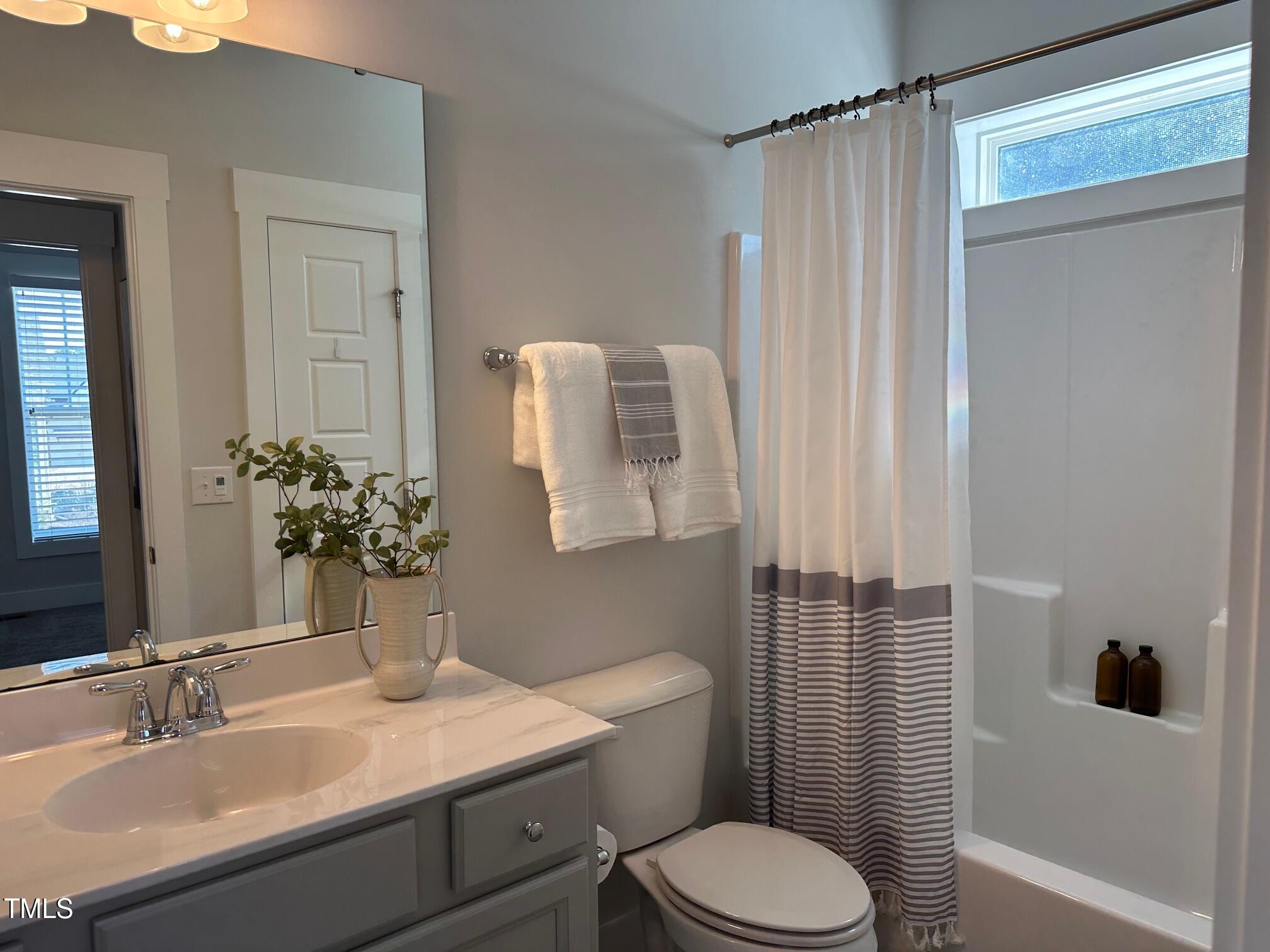 54 Cottage Way Pittsboro, NC 27312 - Photo 16 of 22 a bathroom with a sink toilet and shower