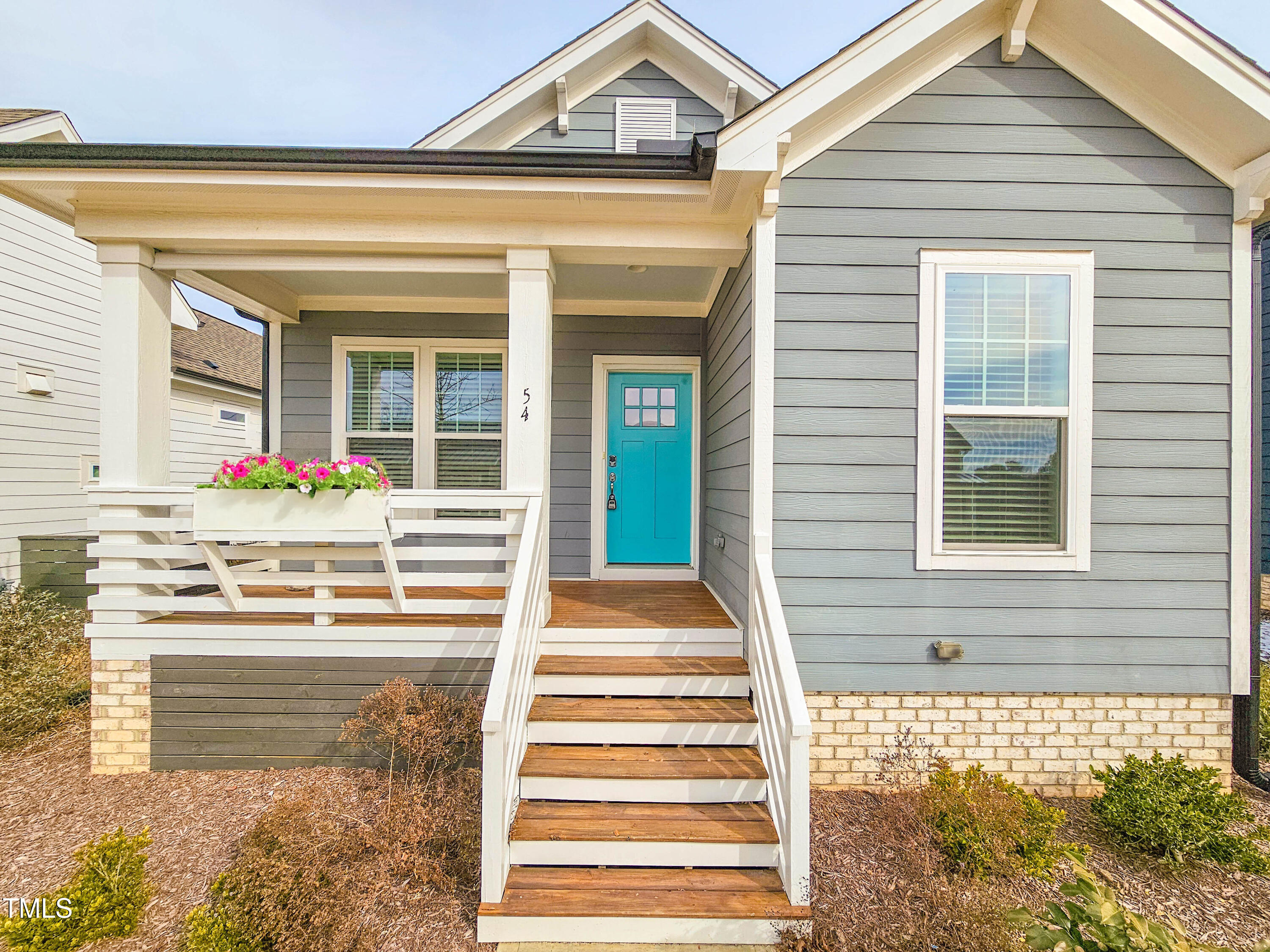 54 Cottage Way Pittsboro, NC 27312 - Photo 2 of 22 a front view of a house with a porch