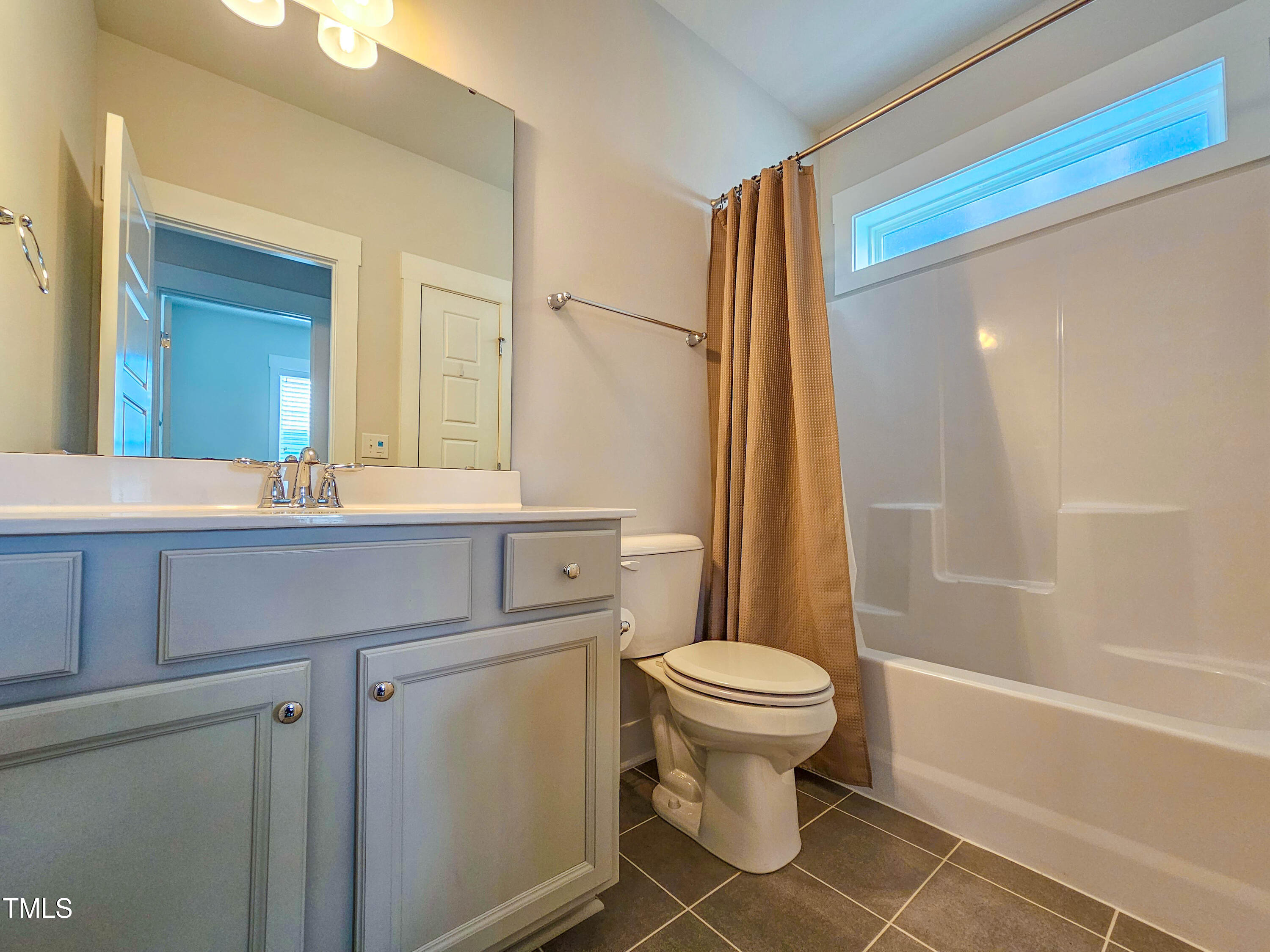 54 Cottage Way Pittsboro, NC 27312 - Photo 21 of 22 a bathroom with a sink a toilet and shower