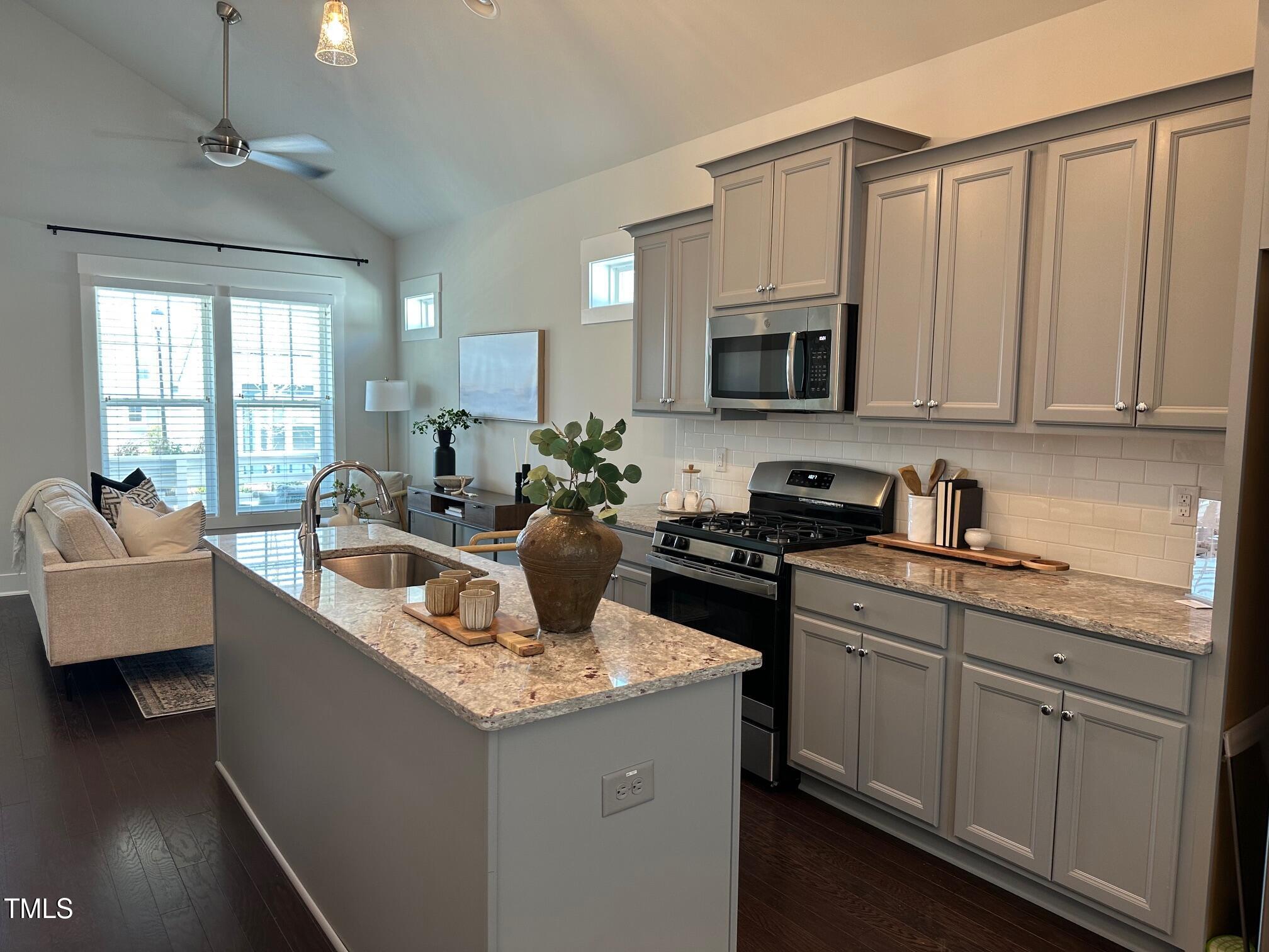 54 Cottage Way Pittsboro, NC 27312 - Photo 7 of 22 a kitchen that has a sink and a stove top oven