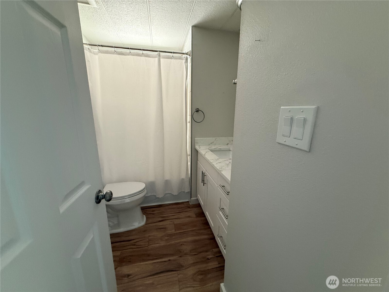 1415 84th Street Southeast, Unit 83 Everett, WA 98208 - Photo 19 of 34 a bathroom with a sink a toilet and shower