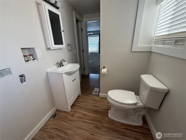 a bathroom with a sink and shower