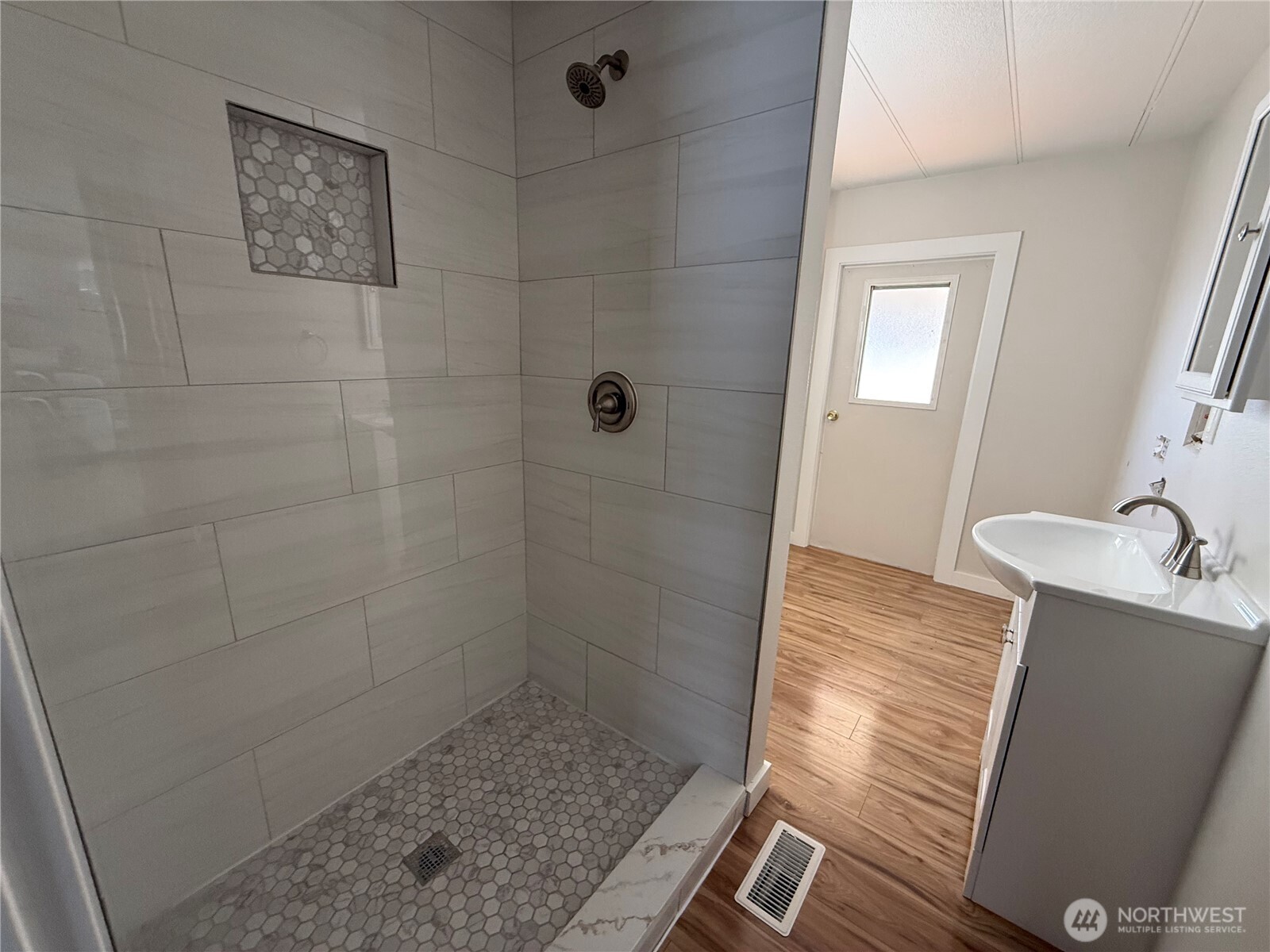 1415 84th Street Southeast, Unit 83 Everett, WA 98208 - Photo 22 of 34 a bathroom with a sink and shower