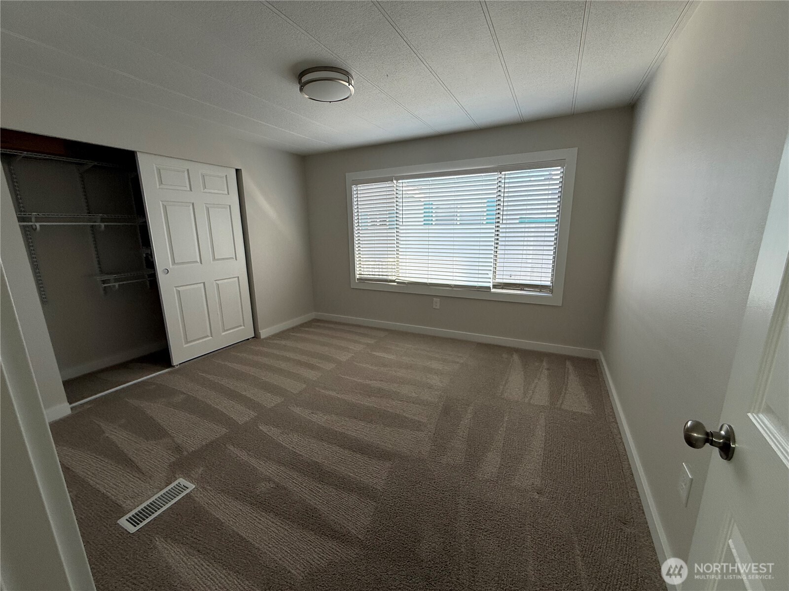 1415 84th Street Southeast, Unit 83 Everett, WA 98208 - Photo 24 of 34 a view of an empty room with a window