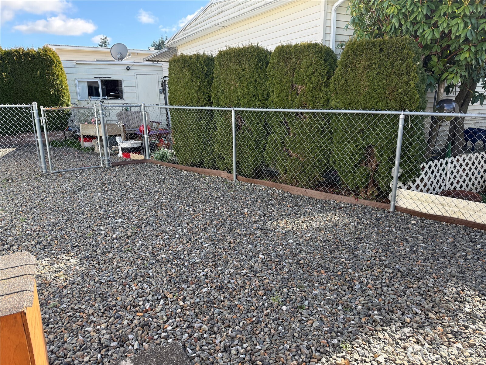 1415 84th Street Southeast, Unit 83 Everett, WA 98208 - Photo 6 of 34 a view of a chair and table in the backyard