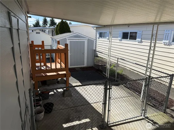 a view of a balcony with chairs