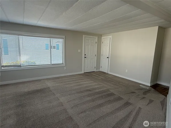 a view of an empty room with a window