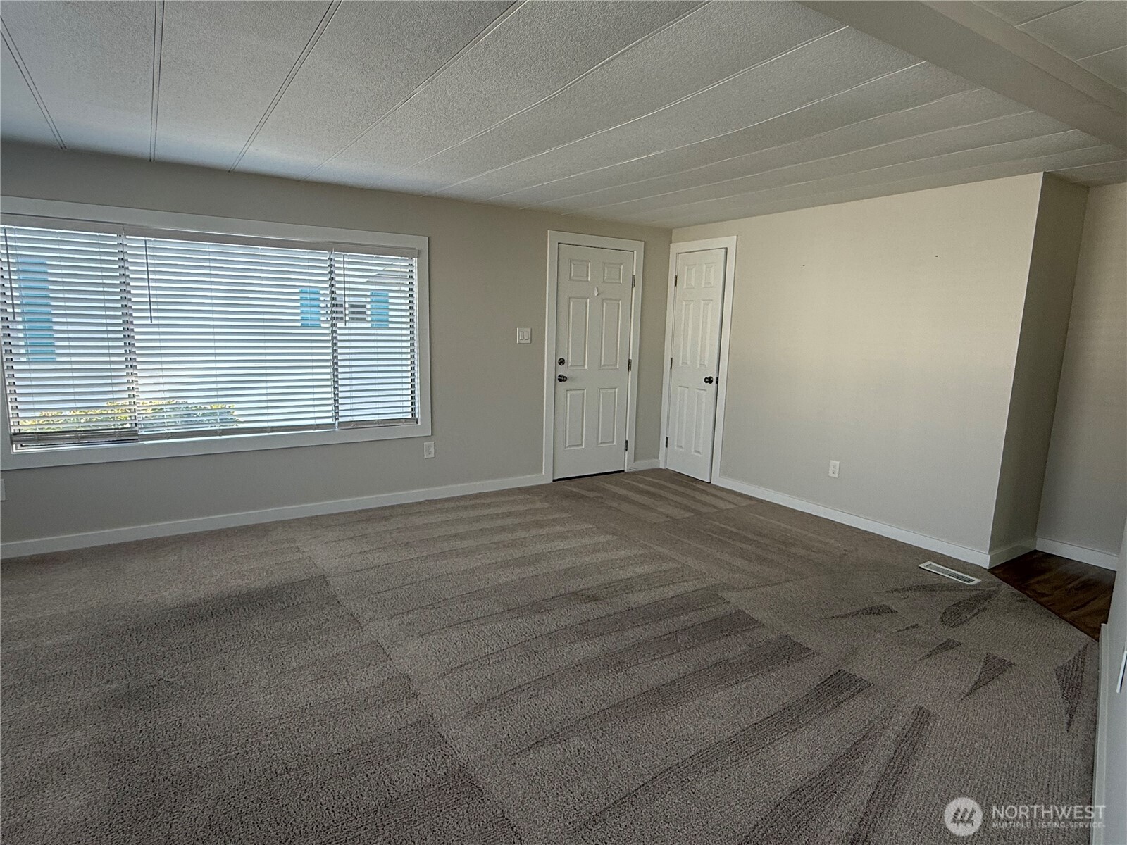 1415 84th Street Southeast, Unit 83 Everett, WA 98208 - Photo 10 of 34 a view of an empty room with a window
