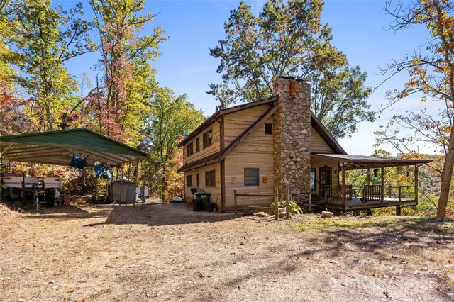 a view of large house with a yard covered in snow