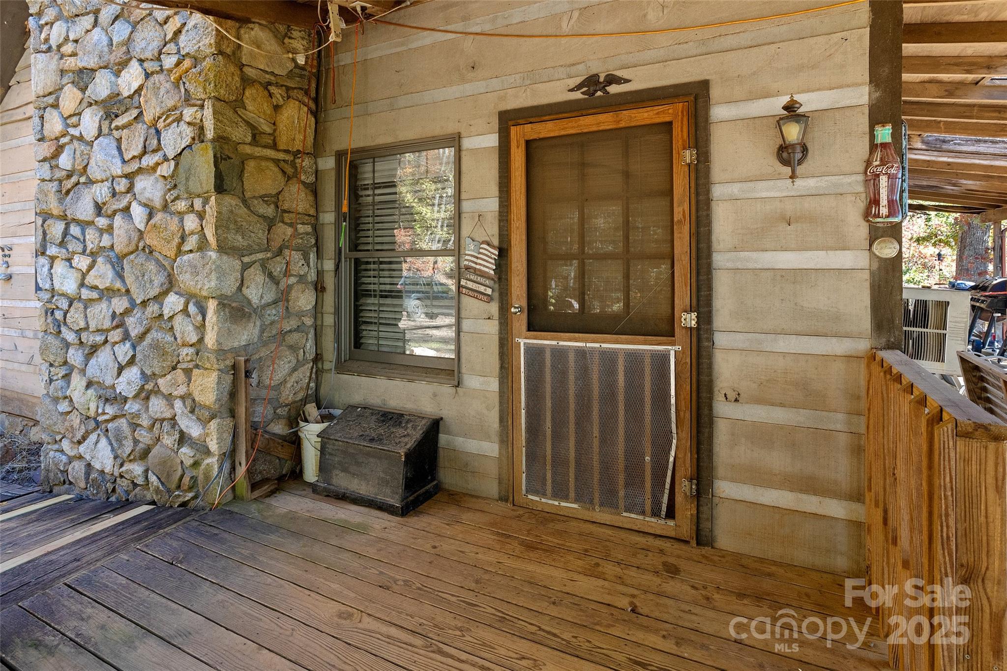 310 Log Gap Road Fairview, NC 28730 - Photo 11 of 46 a view of an empty room with wooden floor and a window