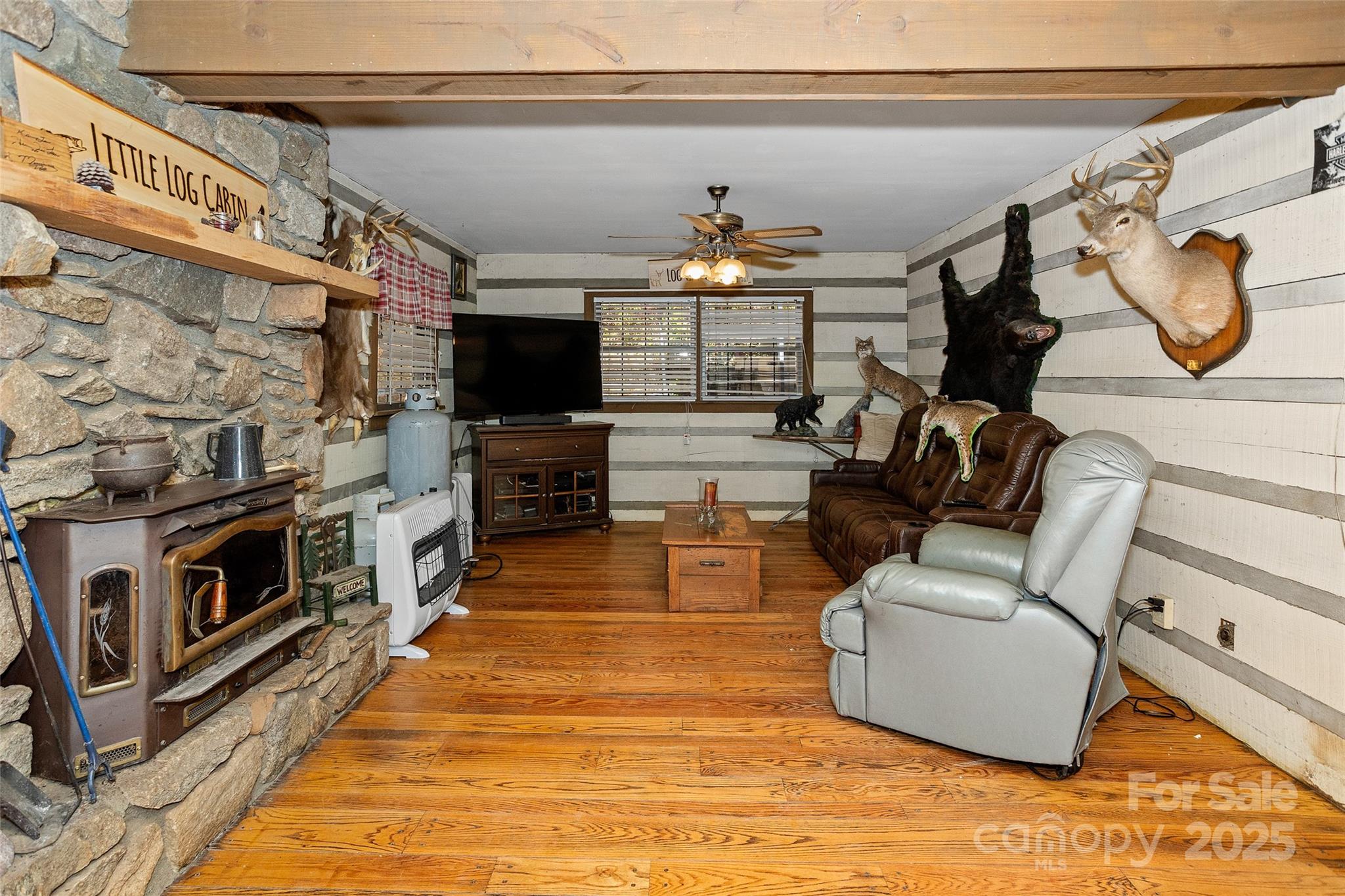 310 Log Gap Road Fairview, NC 28730 - Photo 20 of 46 a living room with furniture a flat screen tv and kitchen view