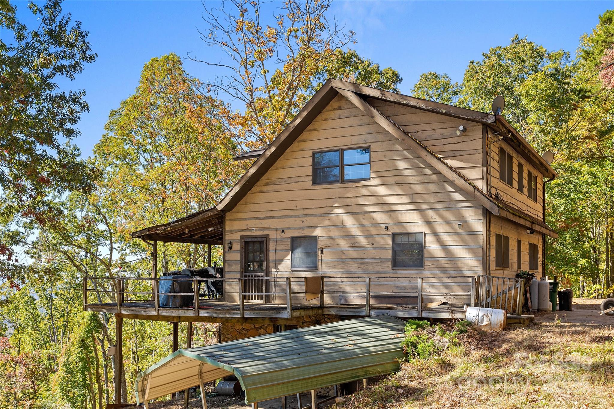 310 Log Gap Road Fairview, NC 28730 - Photo 2 of 46 a backyard of a house with seating space