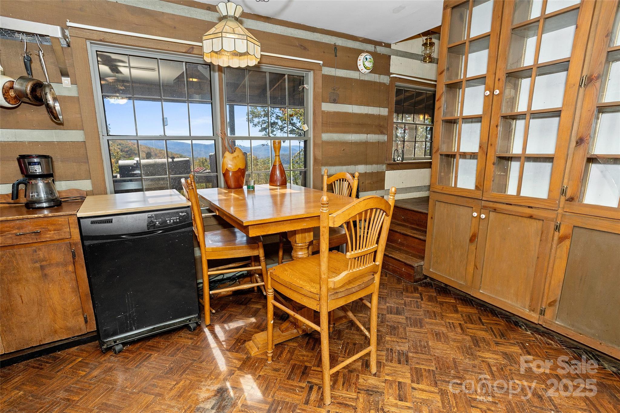 310 Log Gap Road Fairview, NC 28730 - Photo 25 of 46 a dining area with chandelier and outdoor space