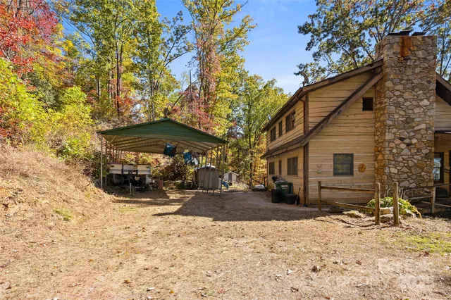 a view of a house with a yard covered in snow