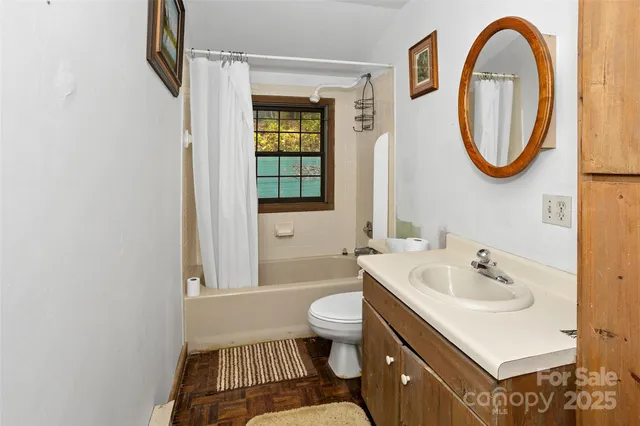 a room with a dresser and a mirror