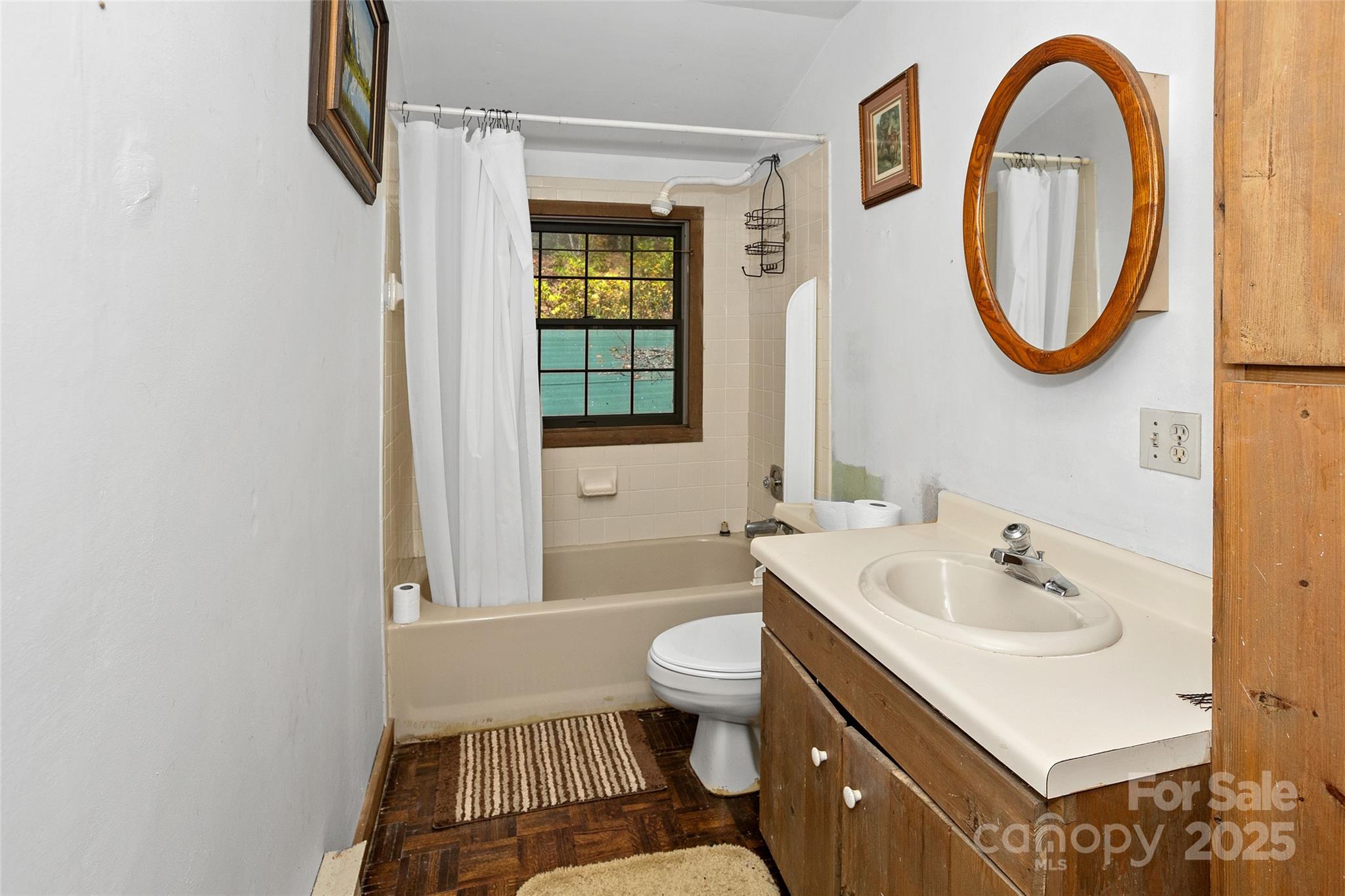 310 Log Gap Road Fairview, NC 28730 - Photo 34 of 46 a bathroom with a sink and a mirror