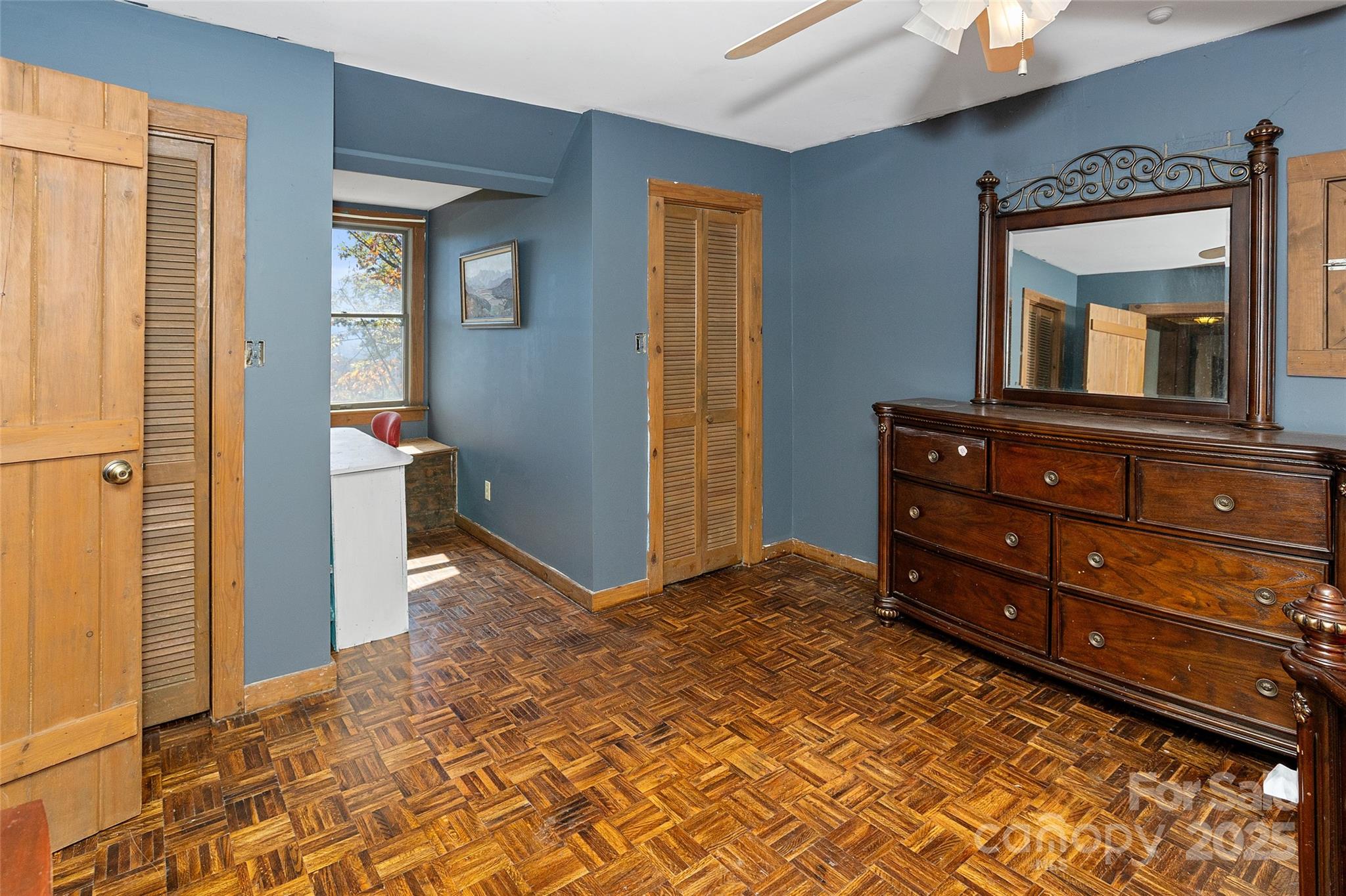 310 Log Gap Road Fairview, NC 28730 - Photo 36 of 46 a room with a dresser and a mirror