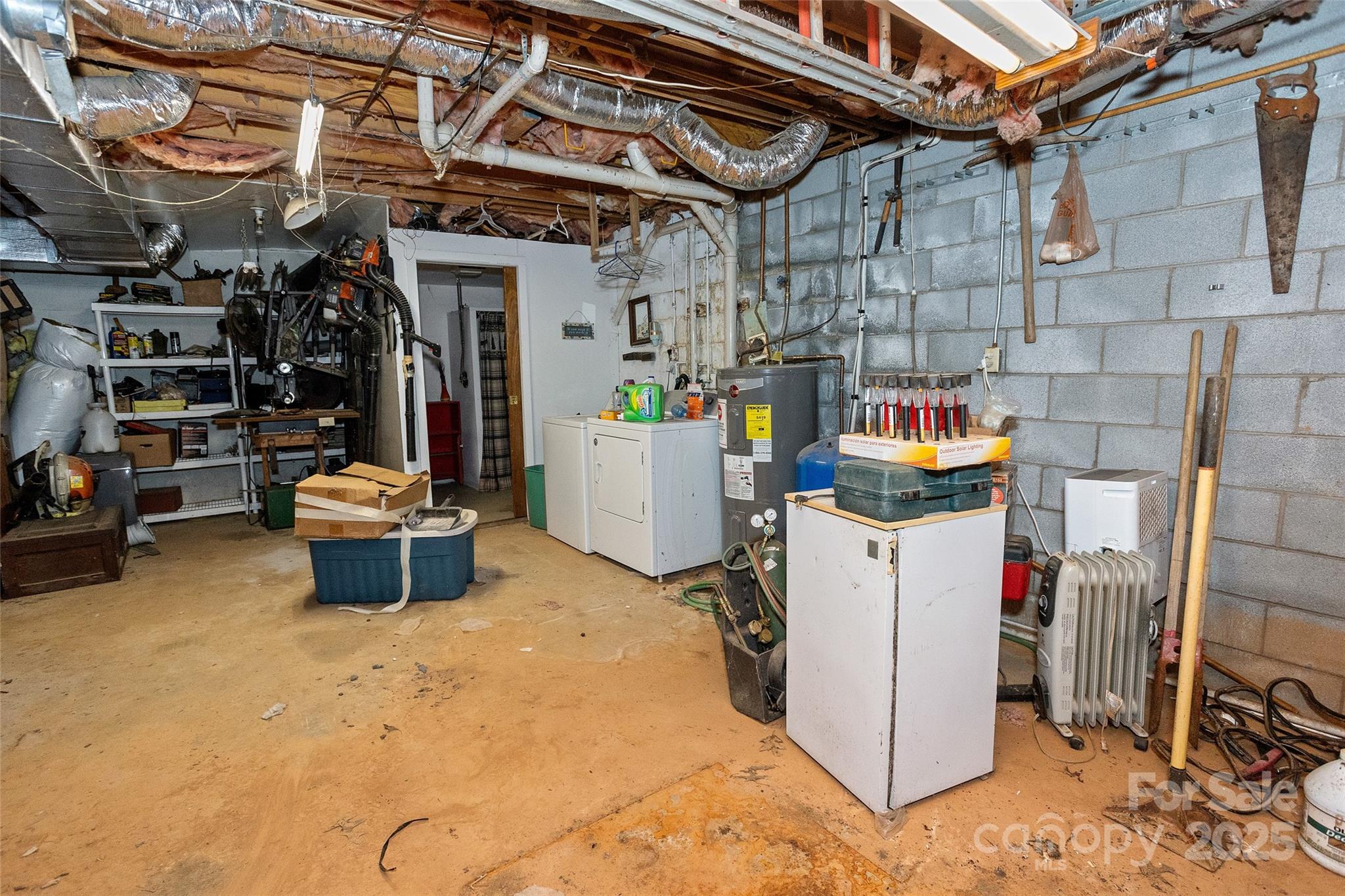 310 Log Gap Road Fairview, NC 28730 - Photo 43 of 46 a utility room with a refrigerator and washer
