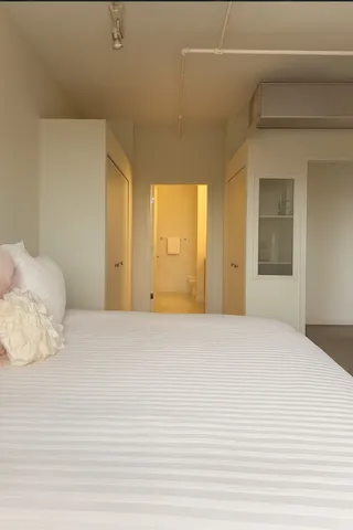 a bathroom with a toilet and a mirror