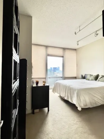 a bathroom with a bathtub and shower
