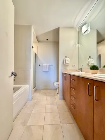 a bathroom with a bathtub and a shower