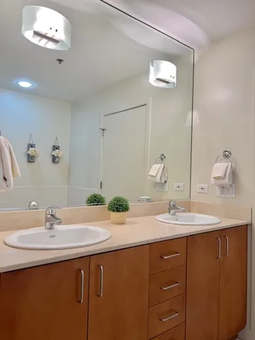 a white toilet sitting next to a shower