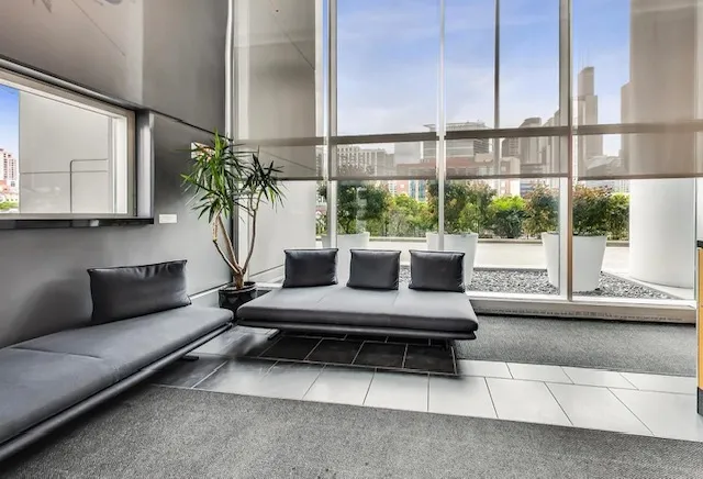a kitchen with stainless steel appliances a refrigerator and a stove top oven