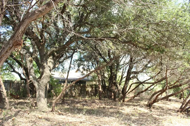 a view of a yard covered with snow
