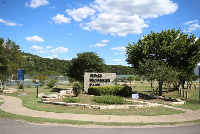 a view of a swimming pool with a yard