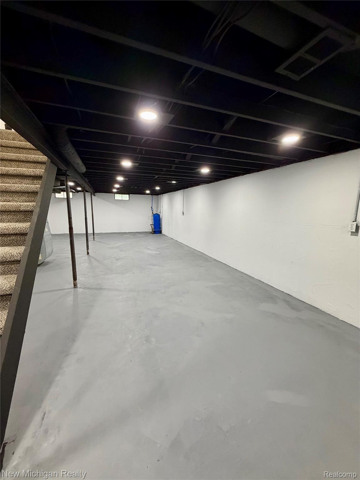 7104 Willard Road Millington, MI 48746 - Photo 24 of 30 Expansive basement space featuring a painted concrete floor and crisp white walls